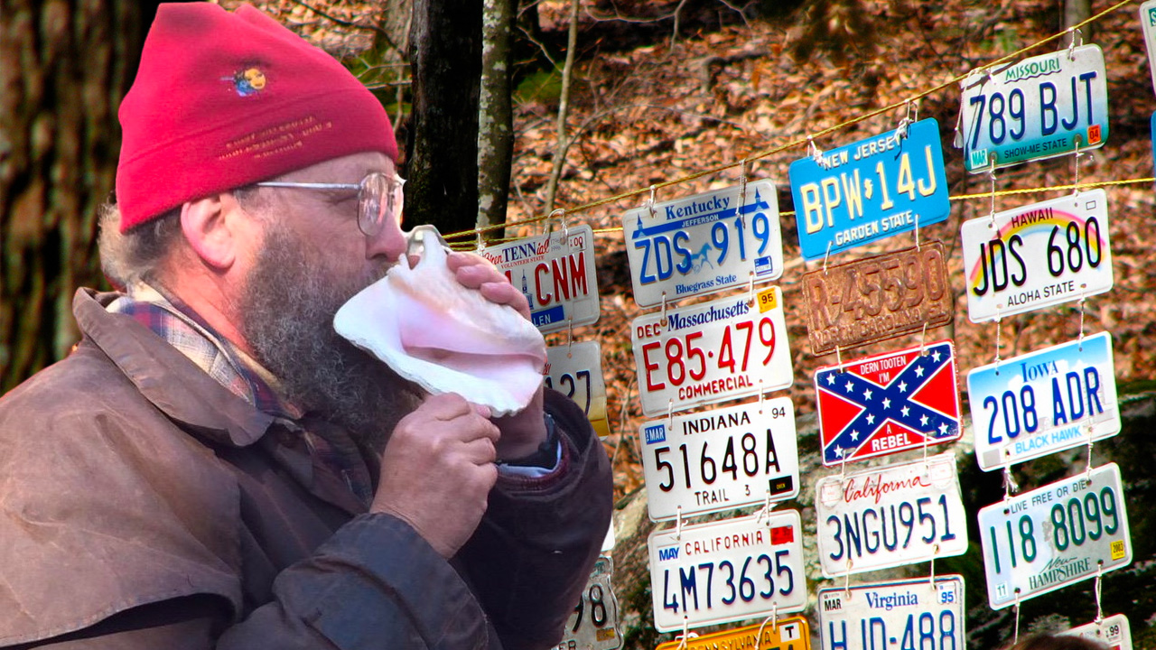Barkley Marathons organiser Laz with famous conch and licence plates